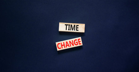 Time change symbol. Concept word Time change on beautiful wooden blocks. Beautiful black paper...