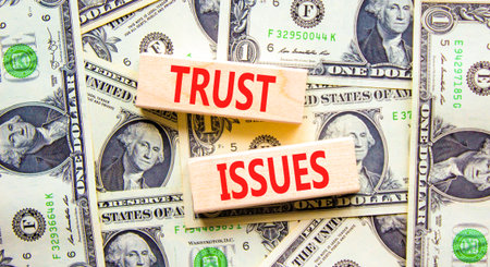 Trust issues symbol. Concept word Trust issues on beautiful wooden blocks. Dollar bills. Beautiful...