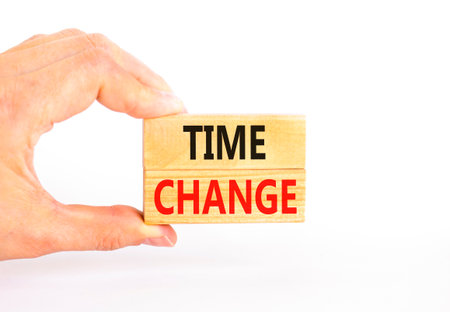 Time change symbol. Concept word Time change on beautiful wooden blocks. Beautiful white paper...