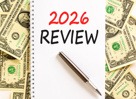 2026 Review symbol. Concept words 2026 Review on beautiful white note. Beautiful dollar bills...