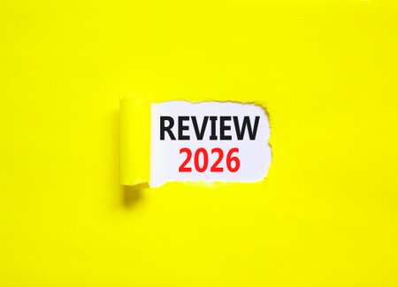 Review 2026 symbol. Concept words Review 2026 on beautiful white paper. Beautiful yellow paper...