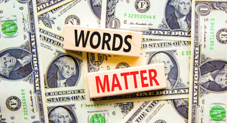 Words matter symbol. Concept word Words matter on beautiful wooden blocks. Dollar bills. Beautiful...