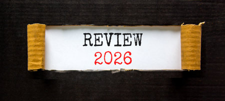Review 2026 symbol. Concept words Review 2026 on beautiful white paper. Beautiful black paper...