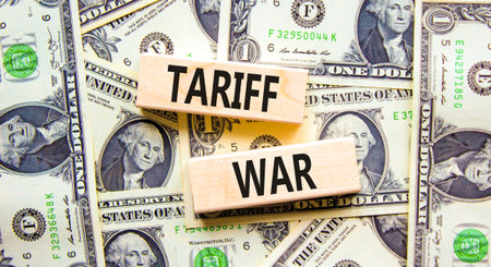 Trade tariff war symbol. Concept word Tariff war on beautiful wooden blocks. Dollar bills. Beautiful dollar bills background. Business trade tariff wars concept. Copy space.の写真素材