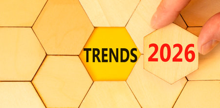 Trends 2026 new year symbol. Concept words Trends 2026 on beautiful wooden puzzles. Beautiful wooden puzzles background. Businessman's hand. Business and Trends 2026 new year concept. Copy space.の写真素材