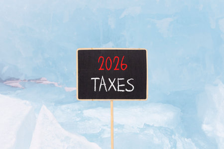 2026 taxes new year symbol. Concept words 2026 taxes on beautiful black blackboard. Beautiful blue...