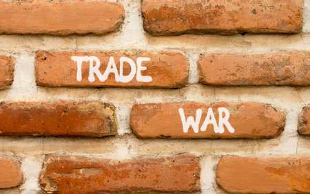 Trade war symbol. Concept word Trade war on beautiful old brown brick wall. Beautiful old brown brick wall background. Old brick wall. Business trade war concept. Copy space.の写真素材