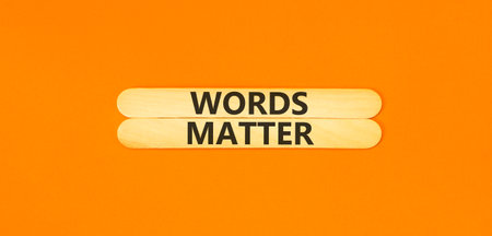 Words matter symbol. Concept word Words matter on beautiful wooden sticks. Beautiful orange paper background. Business words matter concept. Copy space.の写真素材