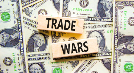 Trade wars symbol. Concept word Trade wars on beautiful wooden blocks. Dollar bills. Beautiful dollar bills background. Business trade wars concept. Copy space.の写真素材