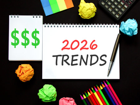 2026 Trends new year symbol. Concept words 2026 Trends on beautiful white note. Beautiful black paper background. Beautiful black pen, calculator. Business 2026 Trends new year concept. Copy space.の写真素材
