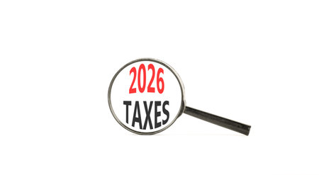 2026 taxes new year symbol. Concept words 2026 taxes on beautiful white paper. Black magnifying glass. Beautiful white paper background. Business and 2026 taxes new year concept. Copy space.の写真素材