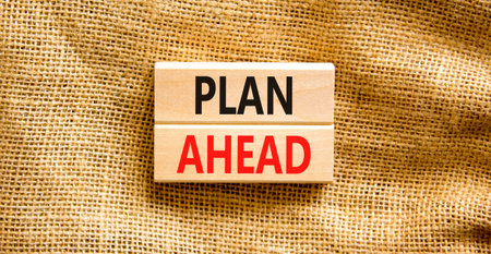 Plan ahead symbol. Concept word Plan ahead on beautiful wooden blocks. Beautiful canvas background. Business plan ahead concept. Copy space.の写真素材