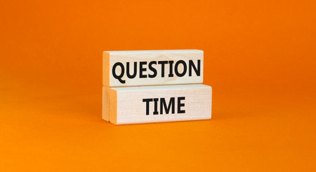 Question time symbol. Concept words Question time on beautiful wooden blocks. Beautiful orange background. Business and question time concept. Copy space.の写真素材