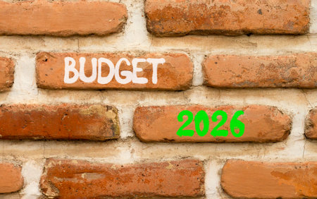 Budget 2026 symbol. Concept words Budget 2026 on beautiful brown brick wall. Beautiful brown brick wall background. Business and budget 2026 concept. Copy space.の写真素材