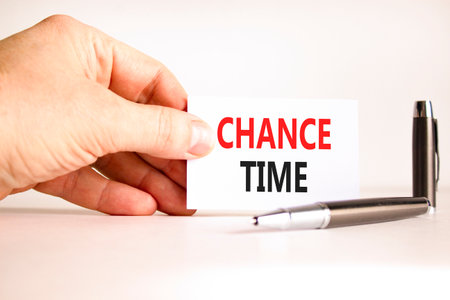 Chance time symbol. Concept word Chance time on beautiful white card. Beautiful black pen. Beautiful white paper background. Businessman's hand. Business chance time concept. Copy space.の写真素材