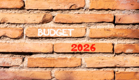 Budget 2026 symbol. Concept words Budget 2026 on beautiful brown brick wall. Beautiful brown brick wall background. Business and budget 2026 concept. Copy space.の写真素材