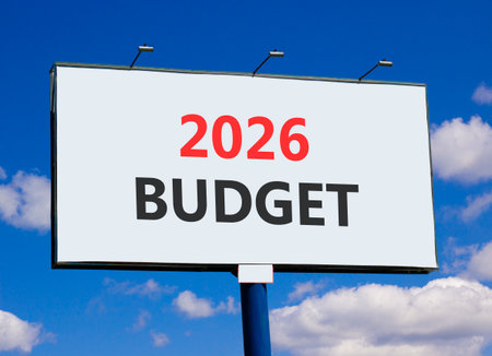 2026 Budget symbol. Concept words 2026 Budget on beautiful big white billboard. Beautiful blue sky and clouds background. Business and 2026 budget concept. Copy space.の写真素材