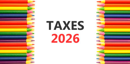 Taxes 2026 new year symbol. Concept words Taxes 2026 on beautiful white paper. Beautiful white paper...