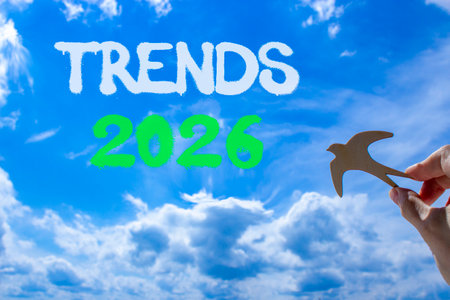 Trends 2026 new year symbol. Concept words Trends 2026 on beautiful blue sky. Beautiful blue sky background. Businessman's hand holds wooden bird. Business and Trends 2026 new year concept. Copy spaceの写真素材
