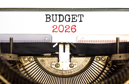 Budget 2026 symbol. Concept words Budget 2026 typed on beautiful old retro typewriter. Beautiful white paper background. Beautiful old typewriter. Business and budget 2026 concept. Copy space.の写真素材