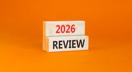 2026 Review symbol. Concept words 2026 Review on beautiful wooden blocks. Beautiful orange paper...