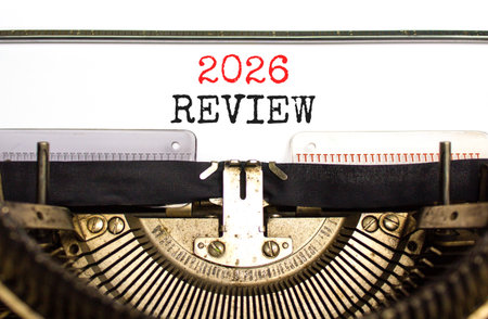 2026 Review symbol. Concept words 2026 Review typed on beautiful old retro typewriter. Beautiful white paper background. Beautiful old typewriter. Business and 2026 review concept. Copy space.の写真素材