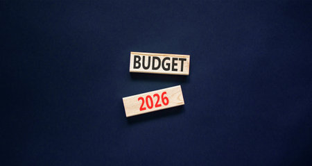 Budget 2026 symbol. Concept words Budget 2026 on beautiful wooden blocks. Beautiful black paper background. Business and budget 2026 concept. Copy space.の写真素材