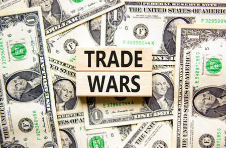Trade wars symbol. Concept word Trade wars on beautiful wooden blocks. Dollar bills. Beautiful...