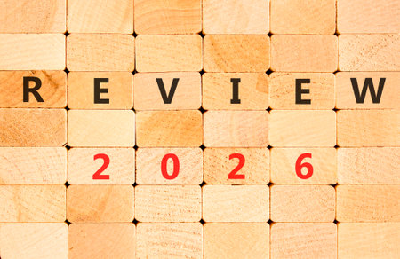 Review 2026 symbol. Concept words Review 2026 on beautiful wooden blocks wall. Beautiful wooden...