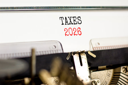 Taxes 2026 new year symbol. Concept words Taxes 2026 typed on beautiful old retro typewriter. Beautiful white background. Beautiful old typewriter. Business and taxes 2026 new year concept. Copy spaceの写真素材