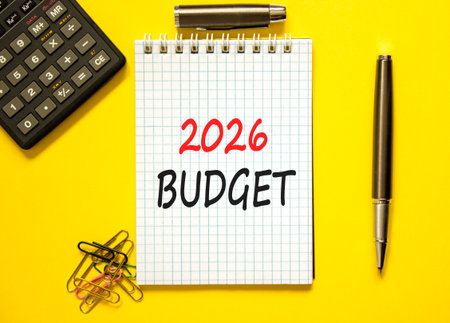 2026 Budget symbol. Concept words 2026 Budget on beautiful white note. Beautiful yellow background....