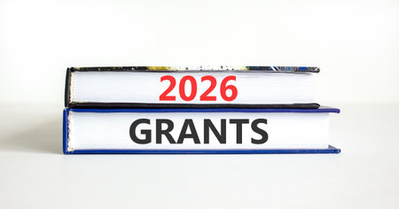 2026 Grants symbol. Concept words 2026 Grants on beautiful books. Beautiful white paper background. Business and 2026 grants concept. Copy space.の写真素材