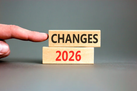 Changes 2026 symbol. Concept words Changes 2026 on beautiful wooden blocks. Beautiful gray paper...