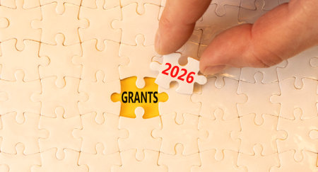 Grants 2026 symbol. Concept words Grants 2026 on beautiful white puzzles. Beautiful white puzzles...