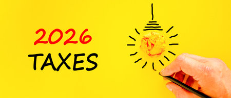 2026 taxes new year symbol. Concept words 2026 taxes on beautiful yellow paper. Beautiful orange...