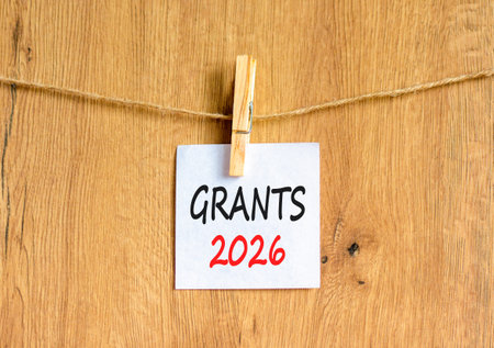 Grants 2026 symbol. Concept words Grants 2026 on beautiful white paper on wooden clothespin....