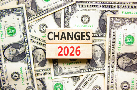 Changes 2026 symbol. Concept words Changes 2026 on beautiful wooden blocks. Beautiful dollar bills...