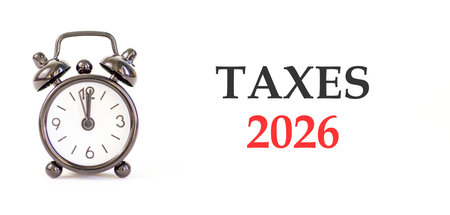 Taxes 2026 new year symbol. Concept words Taxes 2026 on beautiful white paper. Beautiful white paper...