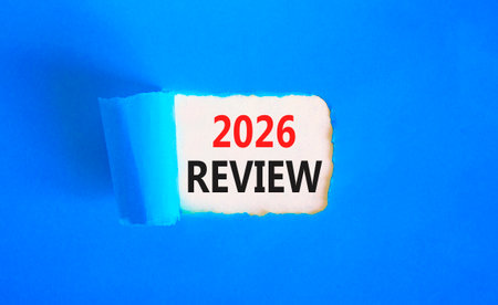 2026 Review symbol. Concept words 2026 Review on beautiful white paper. Beautiful blue paper background. Business and 2026 review concept. Copy space.の写真素材