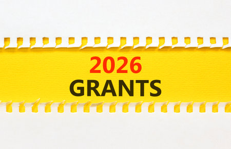 2026 Grants symbol. Concept words 2026 Grants on beautiful yellow paper. Beautiful white paper background. Business and 2026 grants concept. Copy space.の写真素材