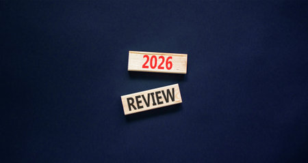 2026 Review symbol. Concept words 2026 Review on beautiful wooden blocks. Beautiful black paper background. Business and 2026 review concept. Copy space.の写真素材