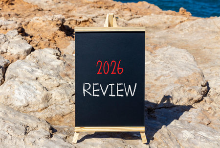 2026 Review symbol. Concept words 2026 Review on beautiful black blackboard. Beautiful stone and...