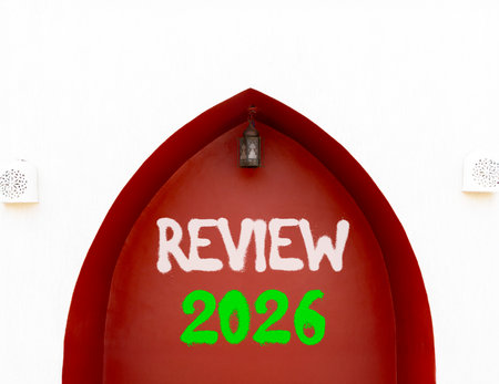 Review 2026 symbol. Concept words Review 2026 on beautiful white and red wall. Beautiful white and red wall background. Business and review 2026 concept. Copy space.の写真素材