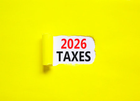 2026 taxes new year symbol. Concept words 2026 taxes on beautiful white paper. Beautiful yellow paper background. Business and 2026 taxes new year concept. Copy space.の写真素材