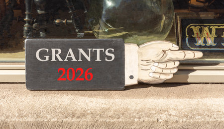 Grants 2026 symbol. Concept words Grants 2026 on beautiful black wooden hand sign. Beautiful shop...