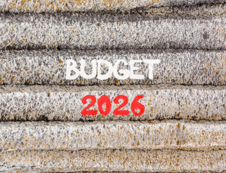Budget 2026 symbol. Concept words Budget 2026 on beautiful gray mountain wall. Beautiful gray...