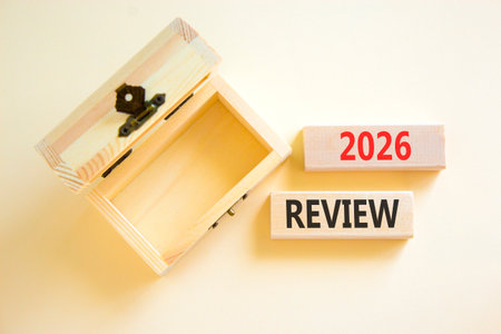 2026 Review symbol. Concept words 2026 Review on beautiful wooden blocks. Beautiful white paper...