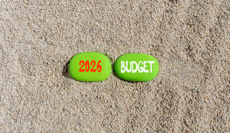 2026 Budget symbol. Concept words 2026 Budget on beautiful green stones on sand beach. Beautiful...