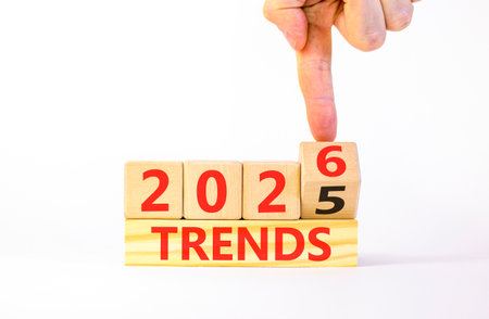 2026 Trends symbol. Concept words 2026 Trends on beautiful wooden blocks. Beautiful white paper...