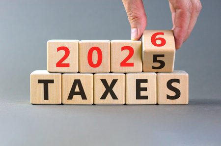 2026 taxes new year symbol. Concept words 2026 taxes on beautiful wooden blocks. Beautiful gray...